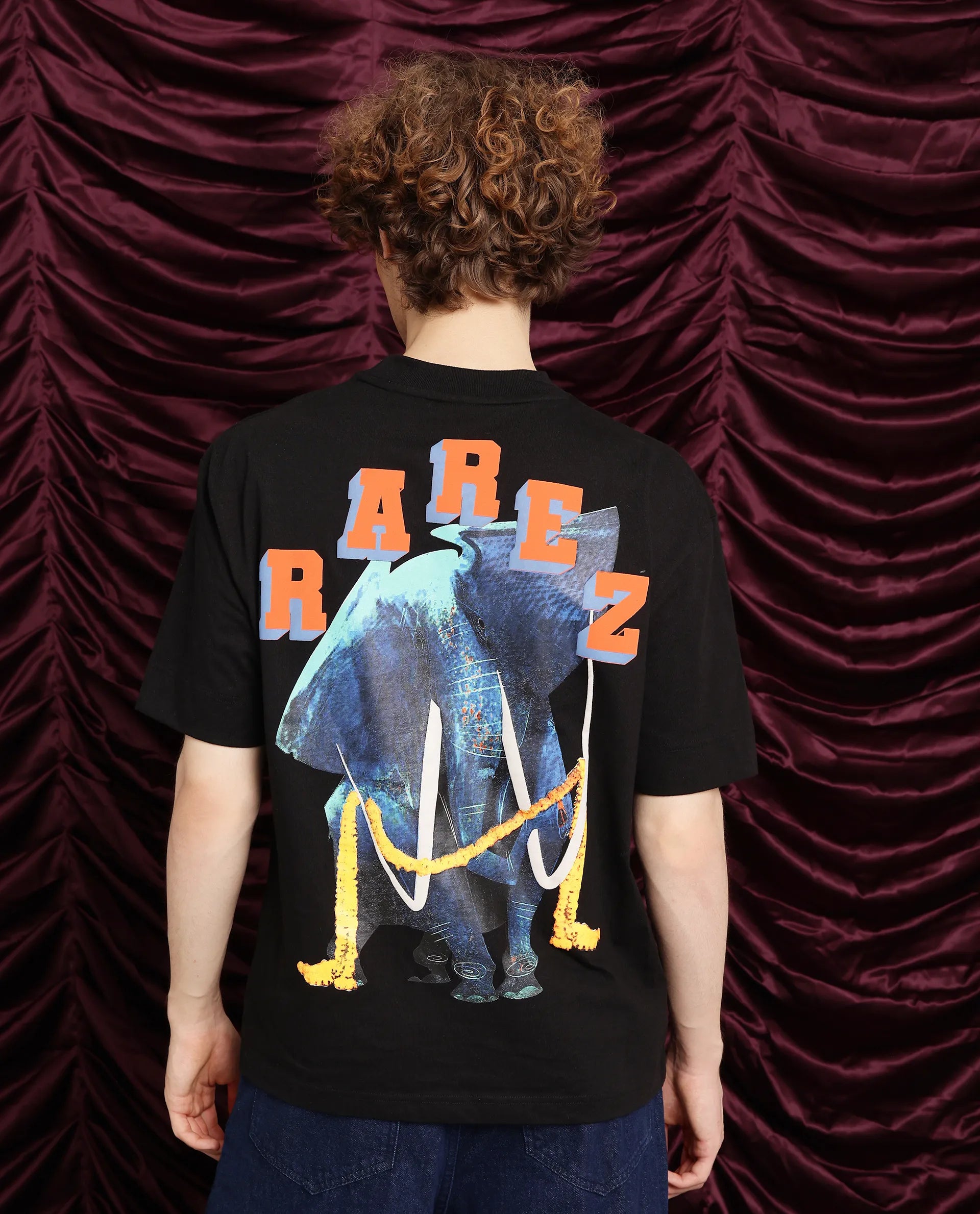 Men's Shirts with Drawstring WaistbandsRare Rabbit Men Elep Black Cotton Fabric Short Sleeve Crew Neck Oversized Fit Graphic Back Print T-Shirt Men's Shirts with Drawstring WaistbandsRare Rabbit Men Elep Black Cotton Fabric Short Sleeve Crew Neck Oversized Fit Graphic Back Print T-Shirt